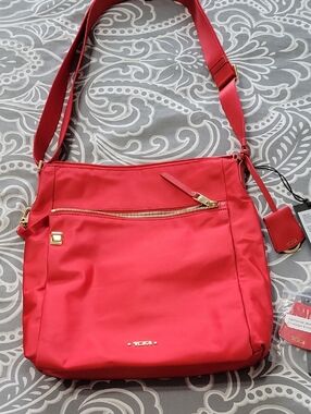 Tumi Red Crossbody Bag with Gold Hardware